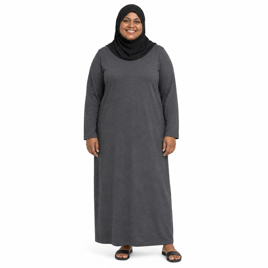 Model in a black hijab wearing a plain charcoal grey long sleeve loose maxi dress on a white background