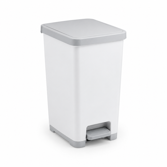 Pedal-operated household trash bin in neutral white and light grey on pure white background