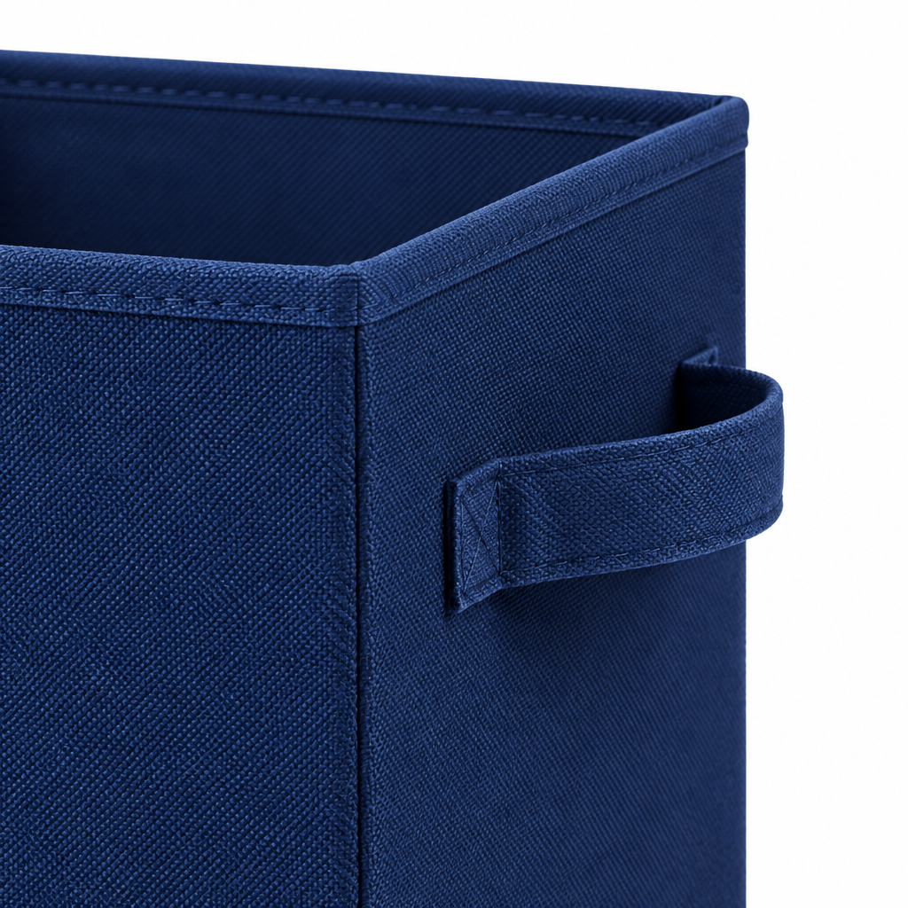 Close-up of fabric storage cube side handle, bound edge stitching and woven fabric texture
