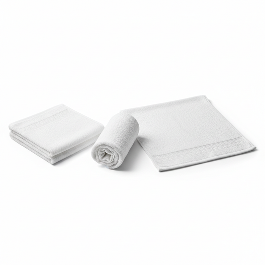 Three white cotton terry hotel face towels shown as folded square, rolled cylinder and open flat displaying 30x30cm size with dobby border and dense terry loop pile on white background, commercial hospitality bathroom face towel