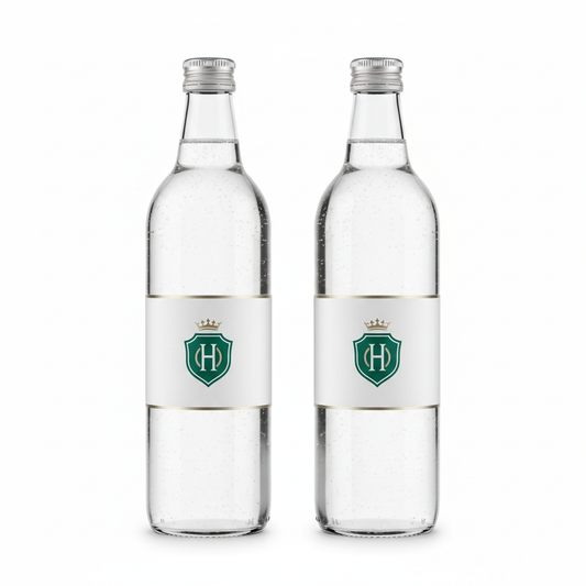Hotel water bottles with custom printed labels and aluminum caps on white background