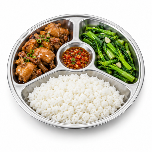 Round stainless steel compartment plate with four divided sections filled with rice, braised chicken, vegetables, and dipping sauce on pure white background