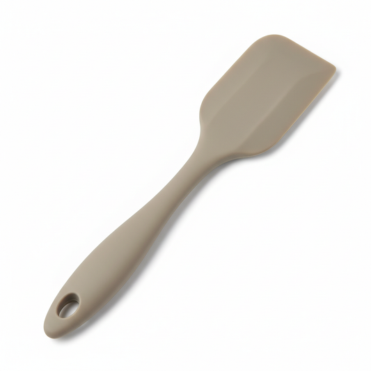 Seamless food-grade silicone spatula with stainless steel core on pure white background